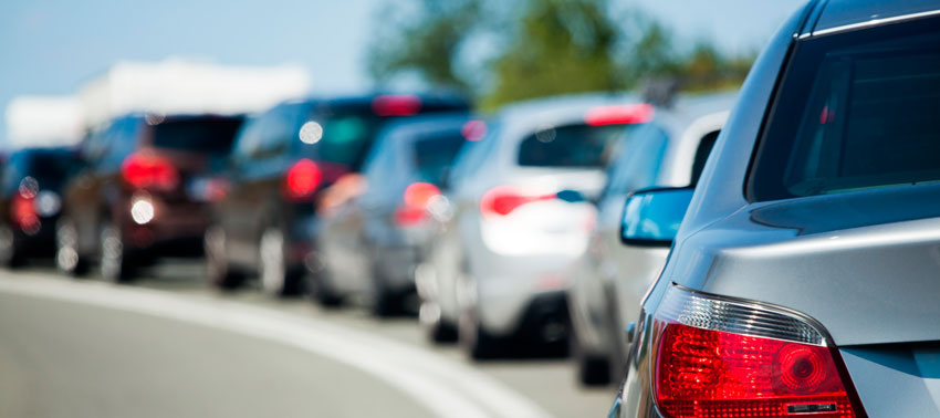 A long line of cars. 